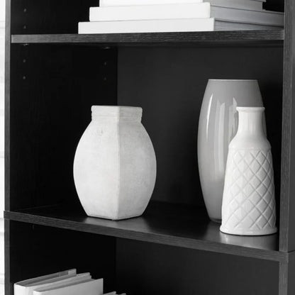Five-shelf bookcase with adjustable shelves.